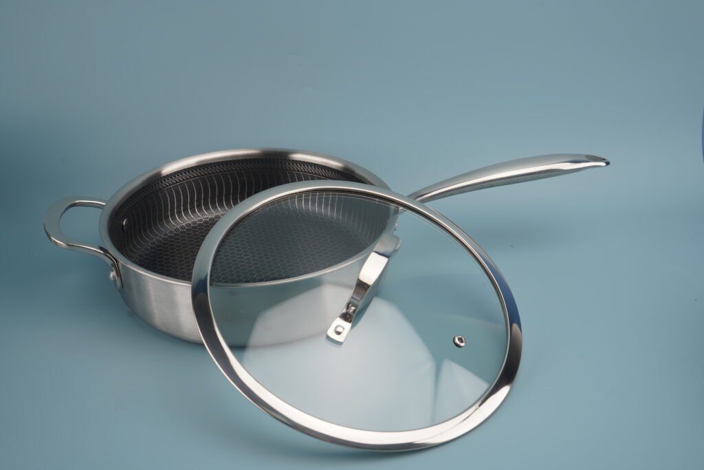 Honeycomb tri-ply deep frying pan with a stainless steel helper handle